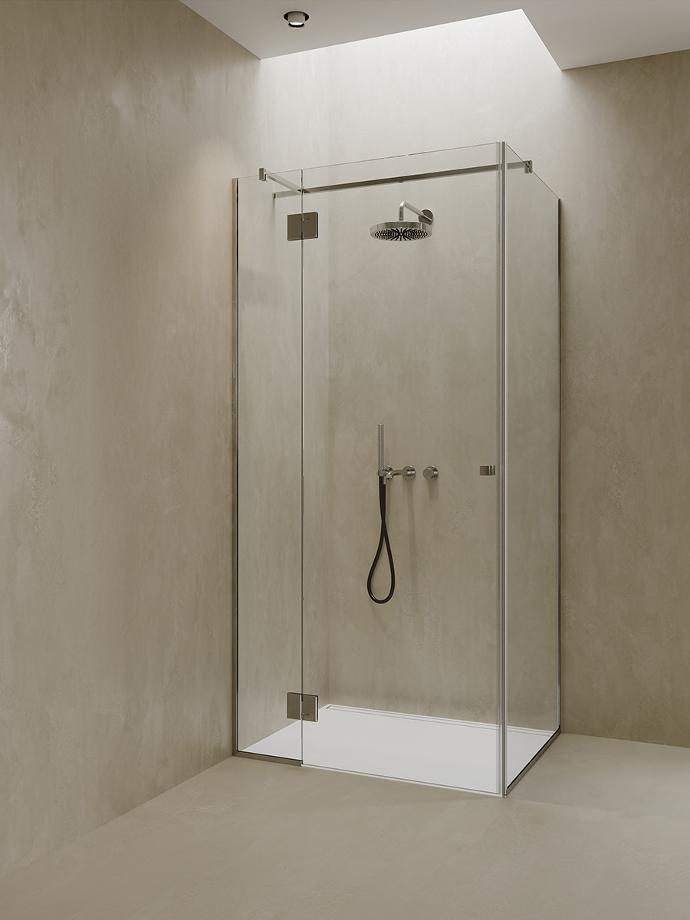 Corner shower cabin with glass doors and fixed glasses.