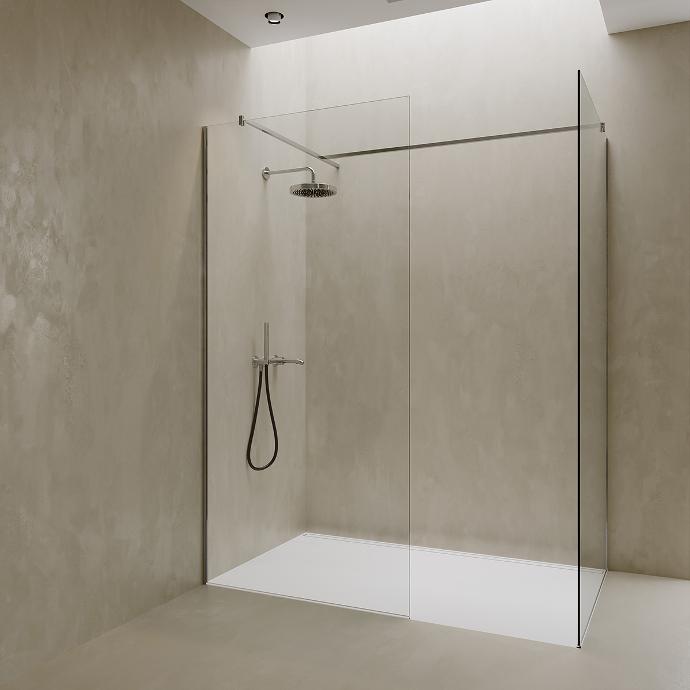 Corner walk-in shower with two fixed glass panels.