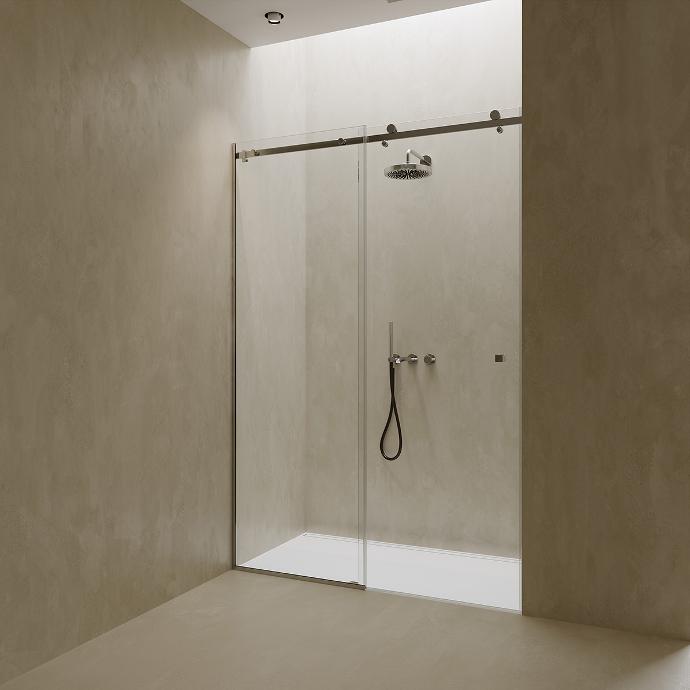 Shower cabin with sliding glass doors in a niche.