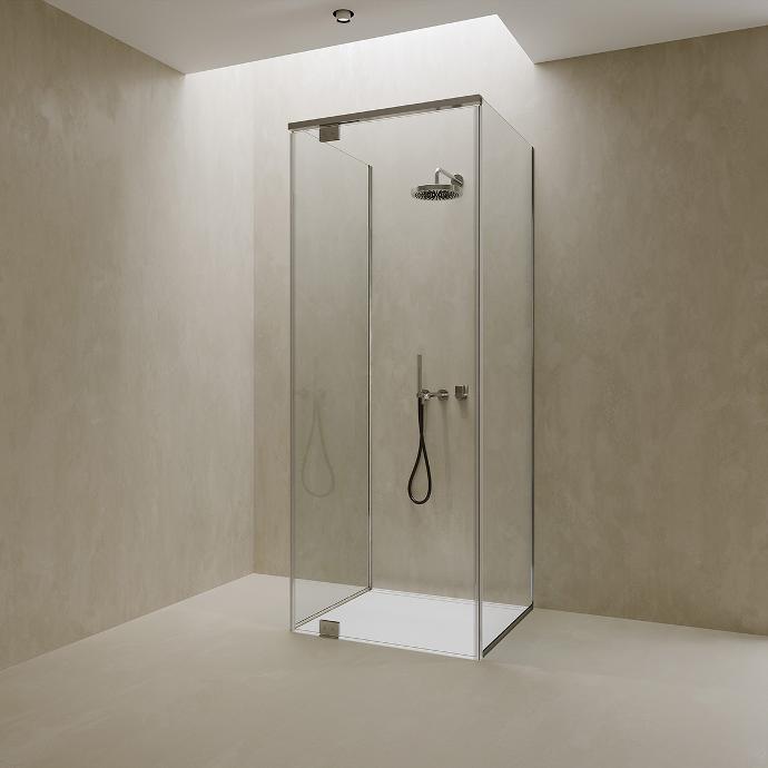 Freestanding shower cabin with glass doors.