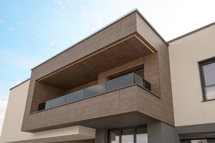 Glass balcony railing on a house.