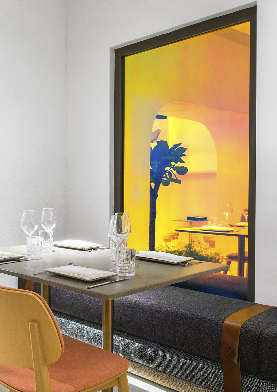 Restaurant interior with a dichroic glass window.  